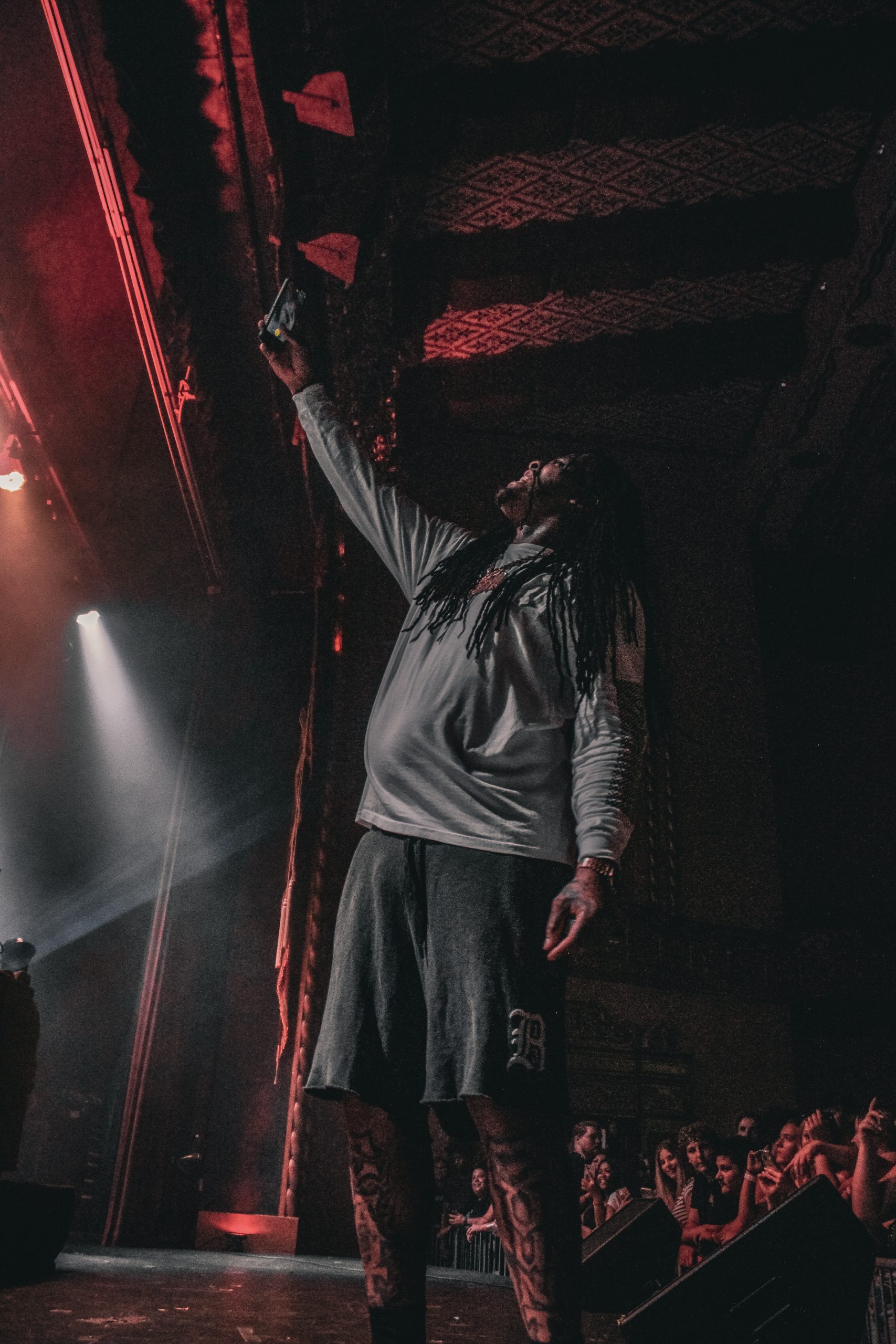 Waka Flocka Flame taking a selfie with a crowd off stage